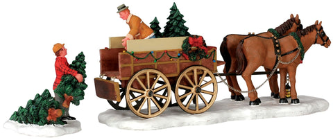 Lemax front view of two figurines loading trees, adding nostalgic village charm