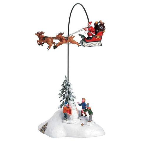 Lemax porcelain building front view with flying Santa, festive focal point