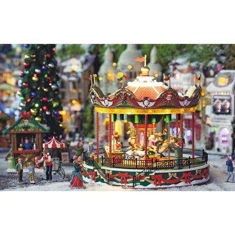 Lemax Santa Carousel in use on a mantel adding motion and seasonal sound