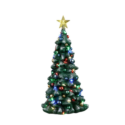 Lemax tree illuminated in village scene providing warm ambiance for displays