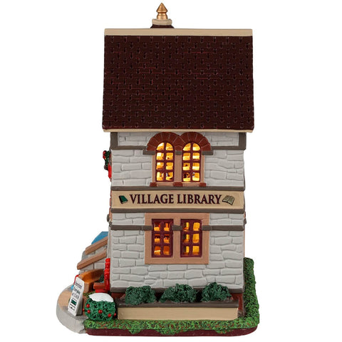 Lemax Village Library styled display among village buildings showing scale