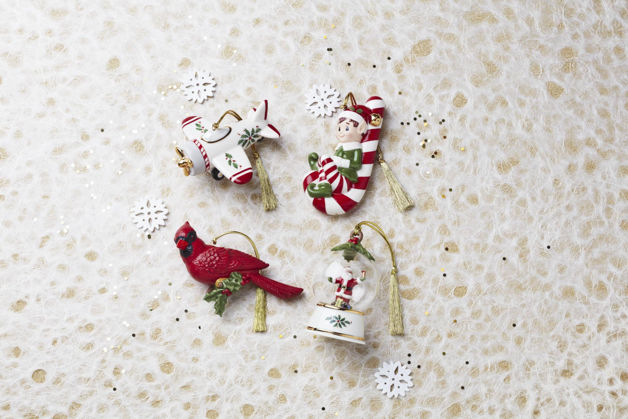 Lenox cardinal hanging on a decorated tree adding traditional color and charm to holiday décor