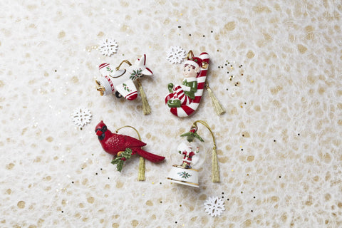 Lenox cardinal hanging on a decorated tree adding traditional color and charm to holiday décor