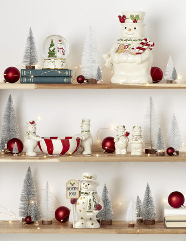 Lenox figurine next to candle demonstrating compact 7.75-inch height and scale
