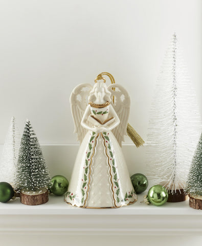 Lenox angel bell hanging on Christmas tree adding charm and soft sound