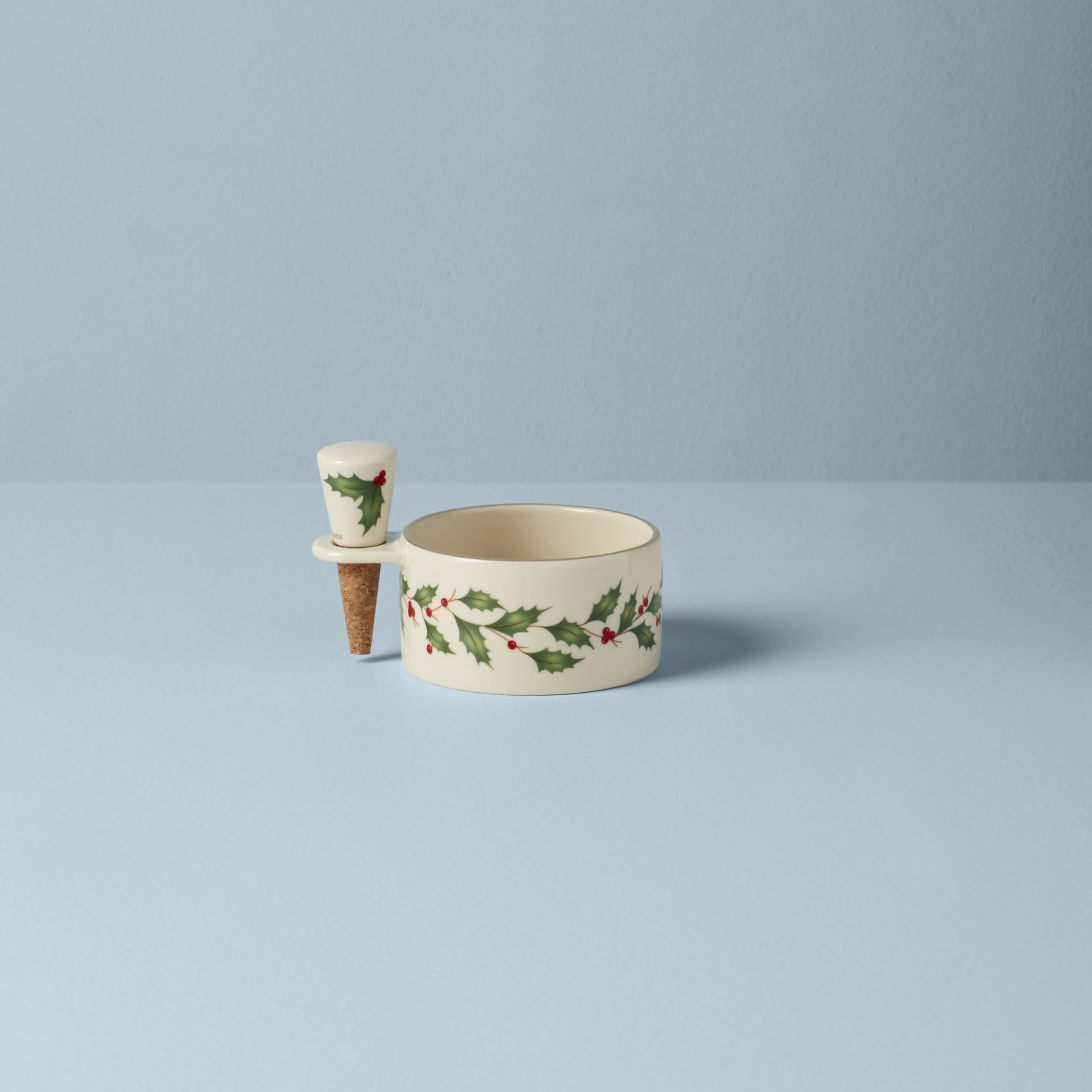 Lenox close-up of holly motif and gold edge highlighting detailed craftsmanship and seasonal charm