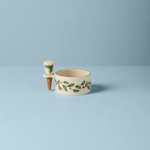 Lenox close-up of holly motif and gold edge highlighting detailed craftsmanship and seasonal charm