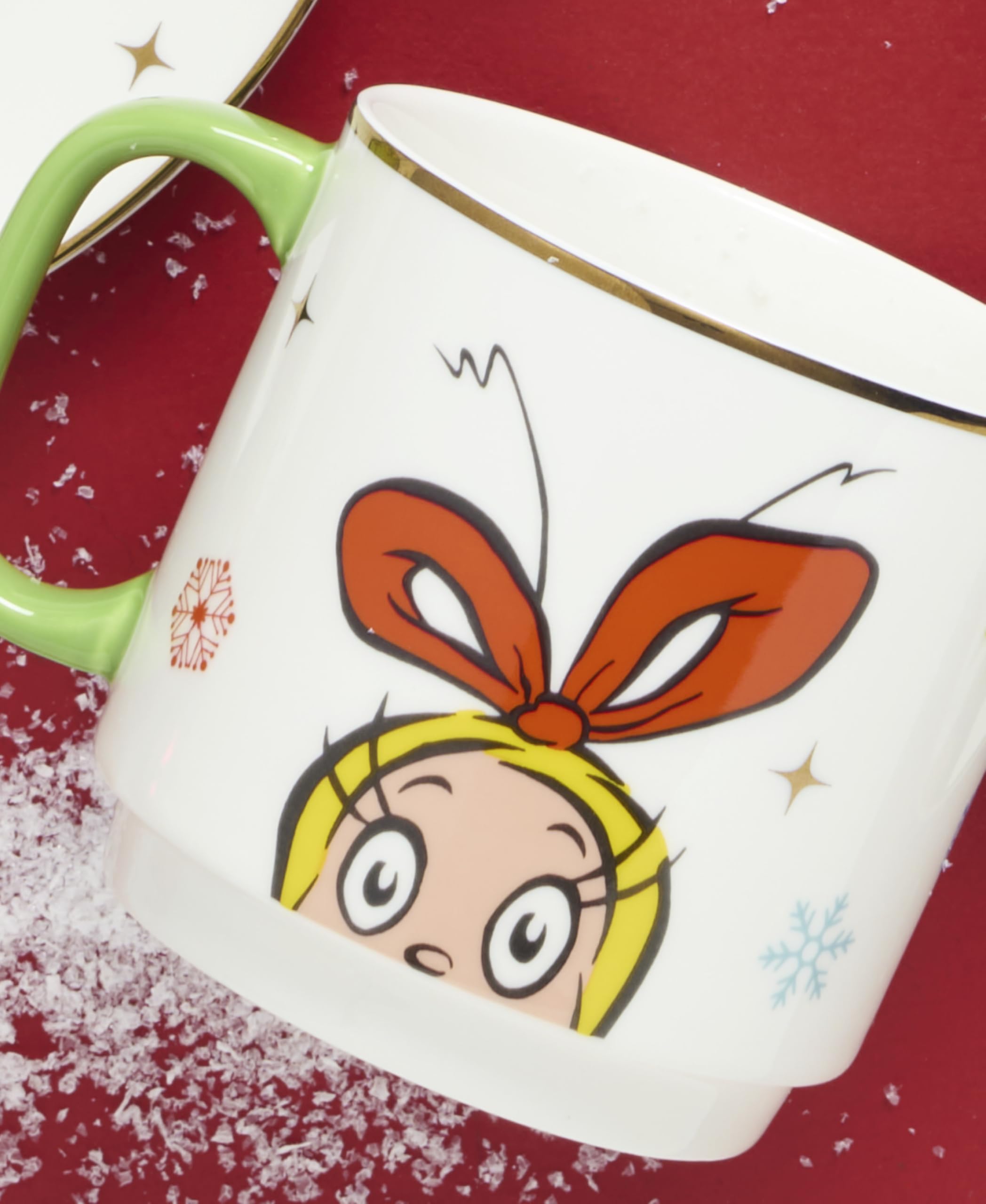 Lenox Merry Grinchmas mug in hand with cocoa showing real-life use, cozy serving benefit