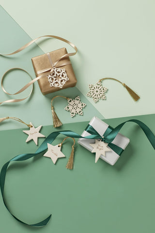 Lenox snowflake beside a ruler showing 2-inch size, helpful scale for decorating