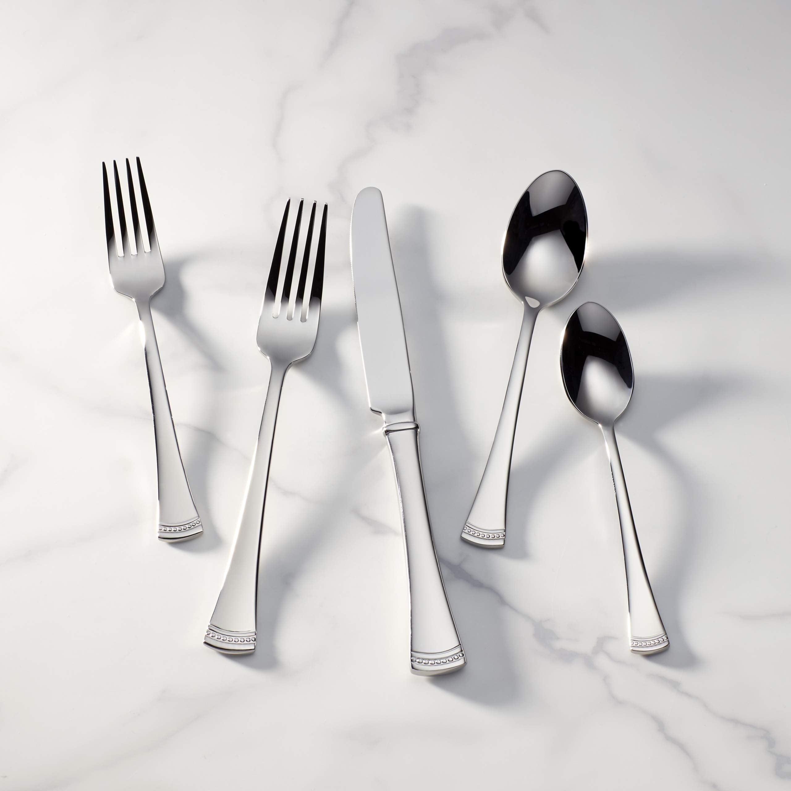 Lenox Portola polished finish reflecting light to enhance table appearance