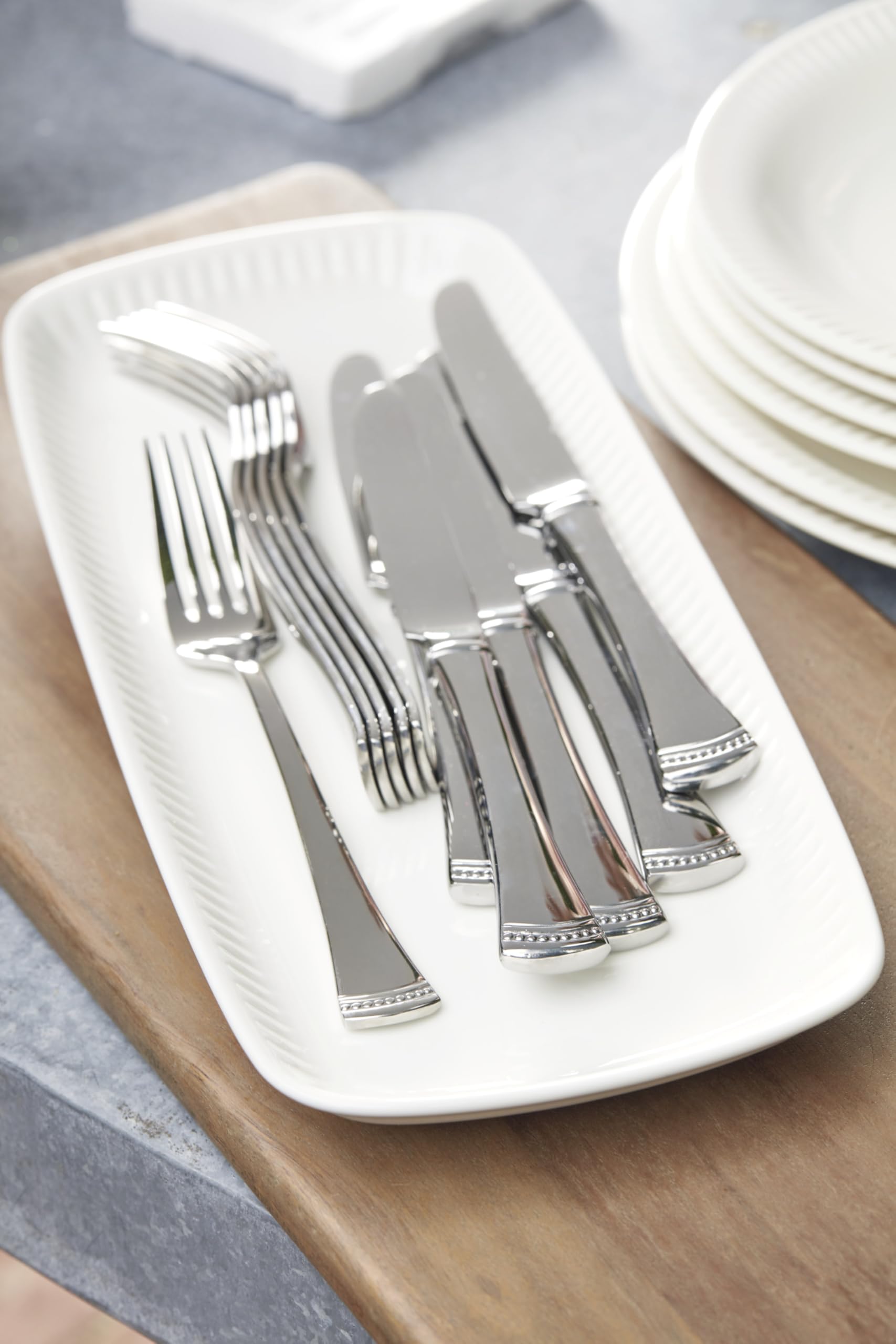 Lenox Portola teaspoon beside cup for scale showing everyday convenience and balanced feel