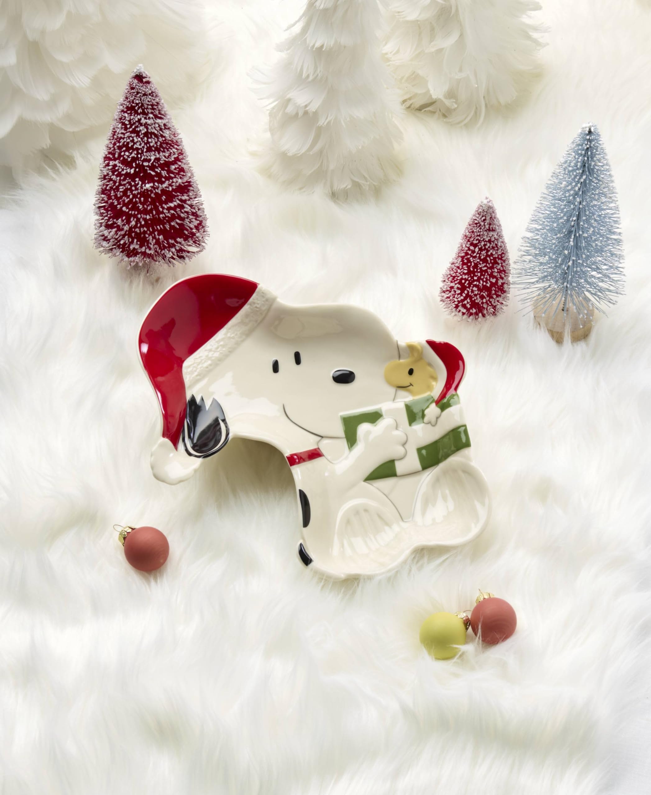 Lenox Snoopy on holiday table setting holding candies to enhance seasonal entertaining