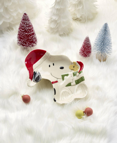 Lenox Snoopy on holiday table setting holding candies to enhance seasonal entertaining