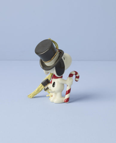 Lenox ornament hanging on a Christmas tree adding nostalgic Peanuts cheer