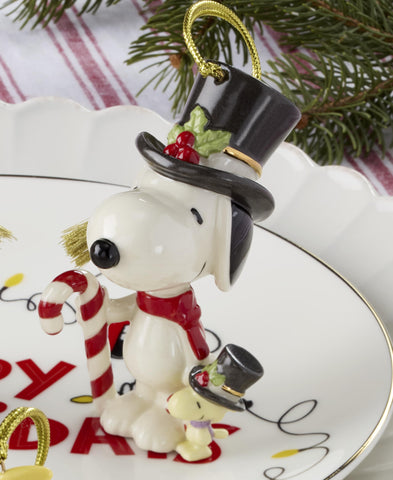 Lenox ornament beside a ruler showing 3x2x4 inch scale for size reference