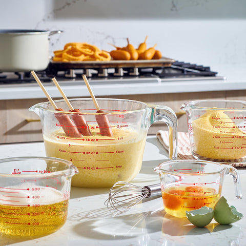 Le'raze measuring spoons and whisk arranged showing versatility and ready-to-use convenience