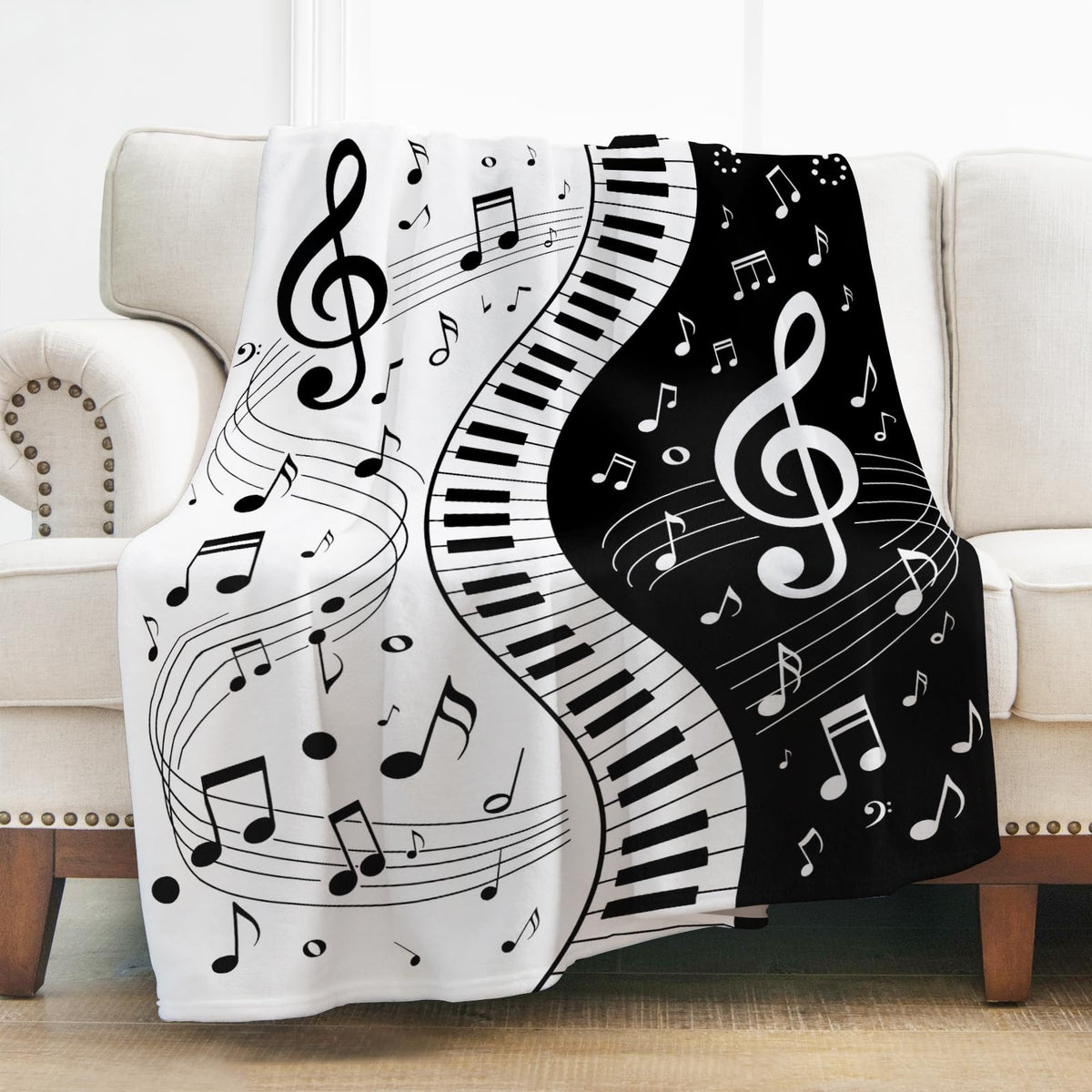 Levens blanket front view showing piano notes design and bold contrast benefit