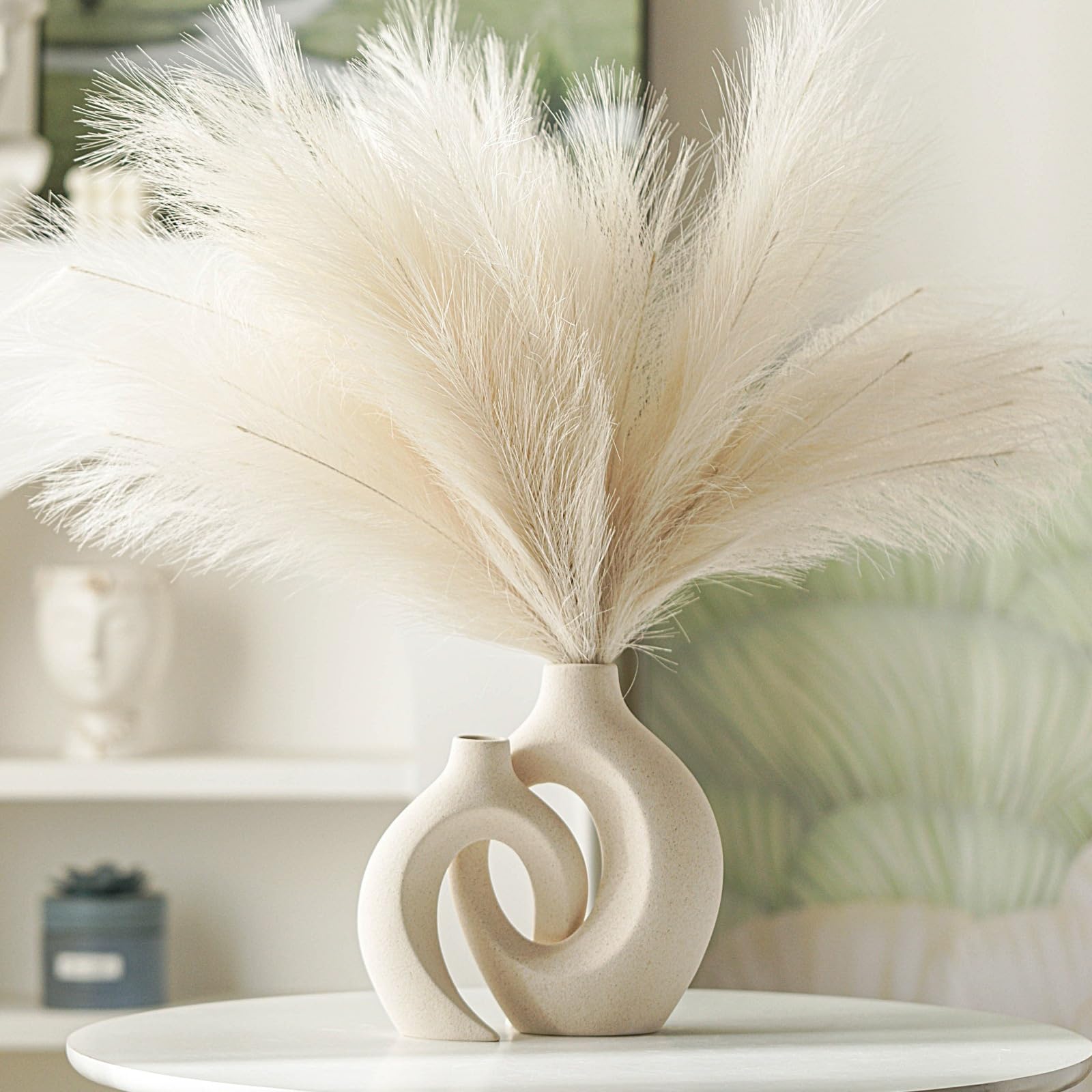 Levvohd vases in minimalist living room showcasing Nordic decor versatility