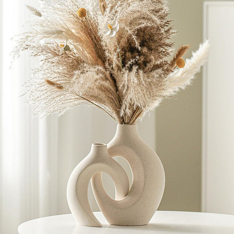Levvohd tall and short vases paired to show complementary heights and balance