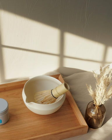 LezayXtra bamboo whisk and ceramic holder close-up showing natural finish and flexibility