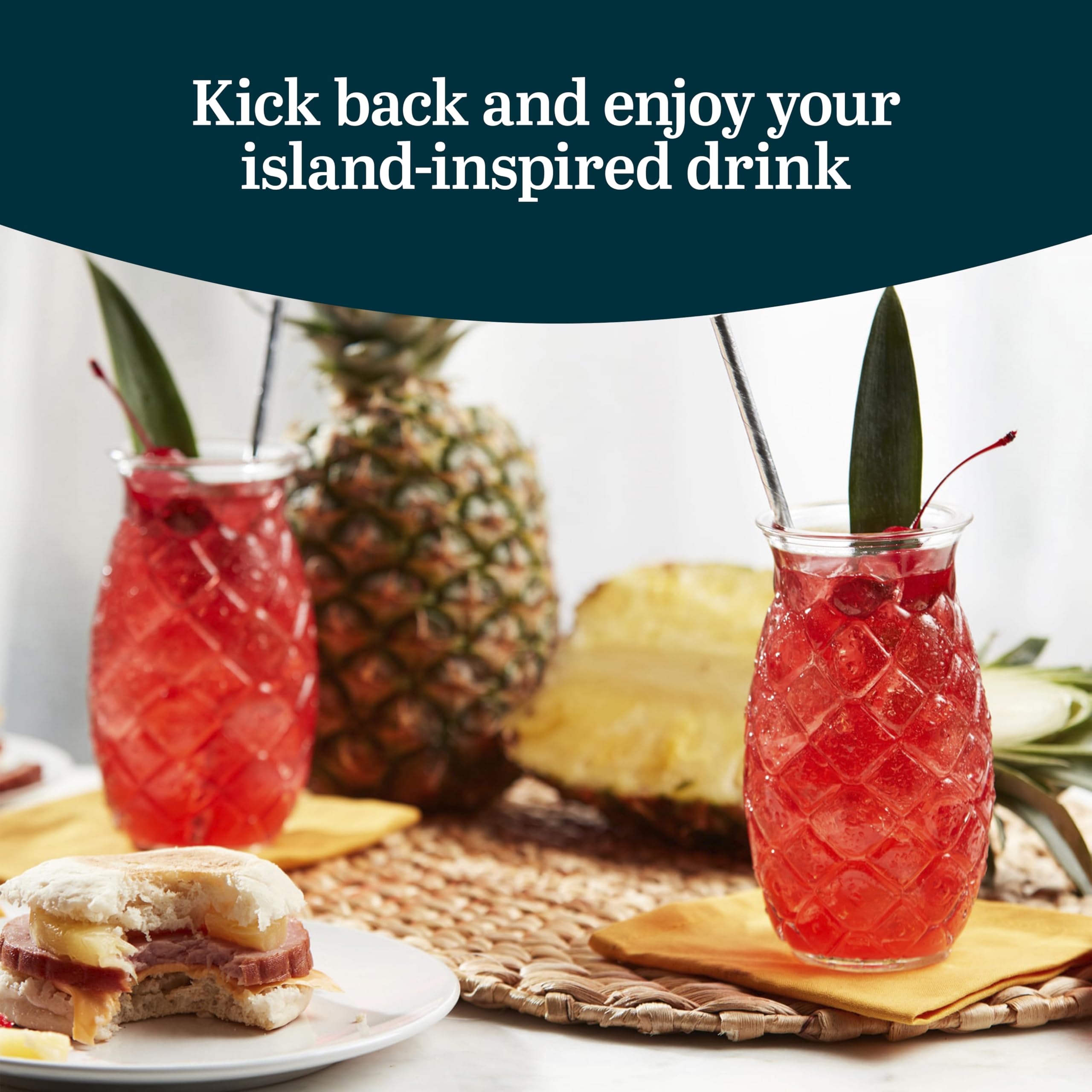Libbey pineapple glass filled with ice and fruit garnish for visual serving ideas