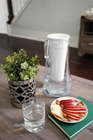 LifeStraw pitcher on kitchen counter in lifestyle scene promoting reduced bottled-water waste