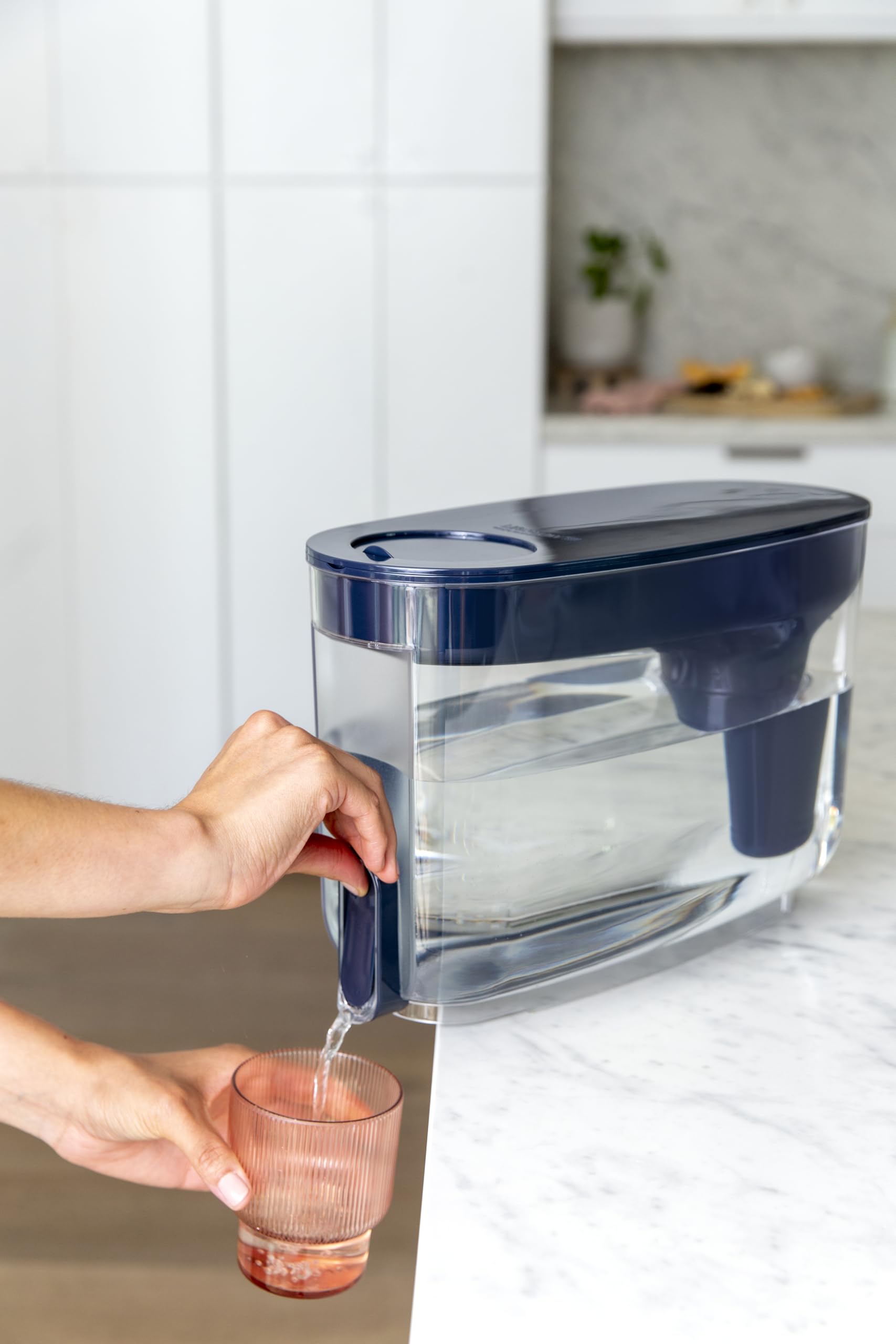 LifeStraw pouring filtered water into a glass showing clear water and improved taste