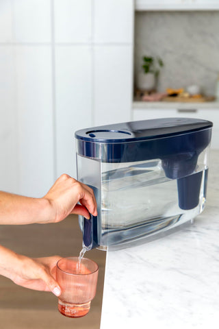 LifeStraw pouring filtered water into a glass showing clear water and improved taste