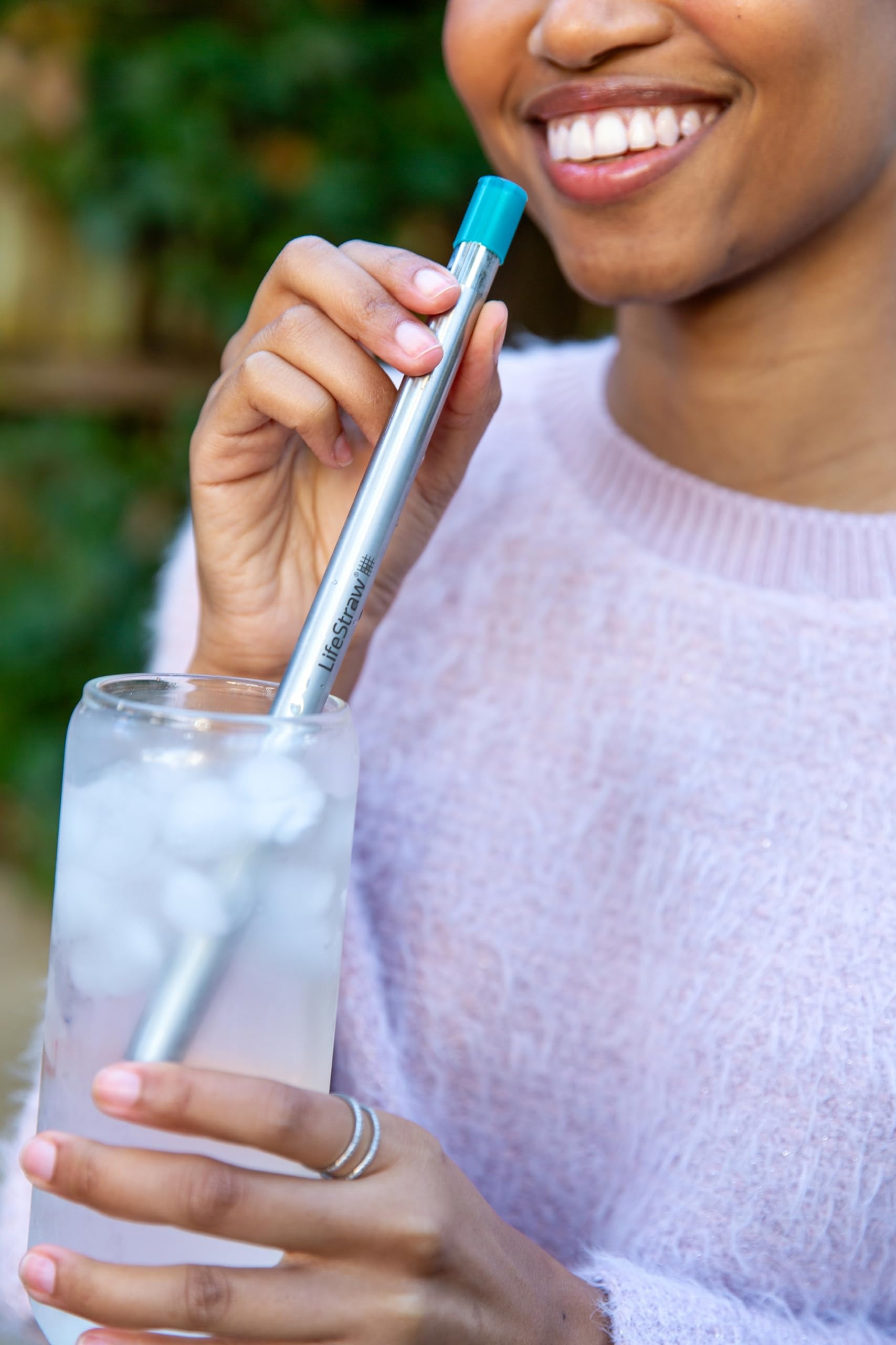 LifeStraw Sip beside smartphone for scale, showing compact lightweight travel benefit