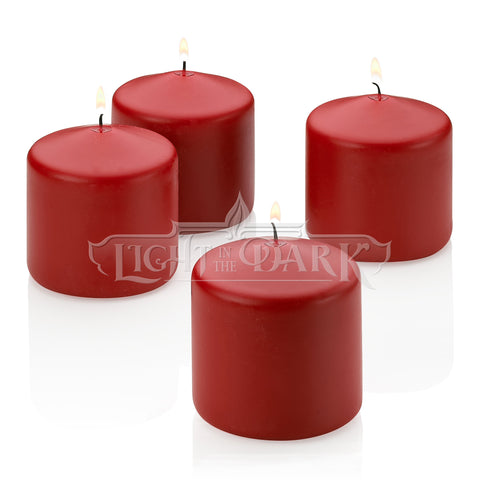 Light In The Dark front-facing four-pack showing red apple cinnamon pillars and sizing benefit