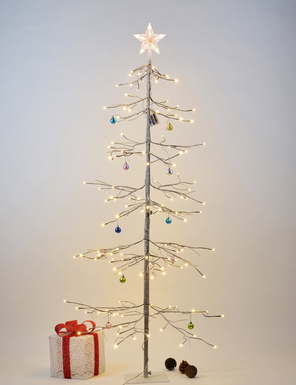 LIGHTSHARE 6ft snowy fir front view showing warm-white LEDs and frosted branches for cozy decor