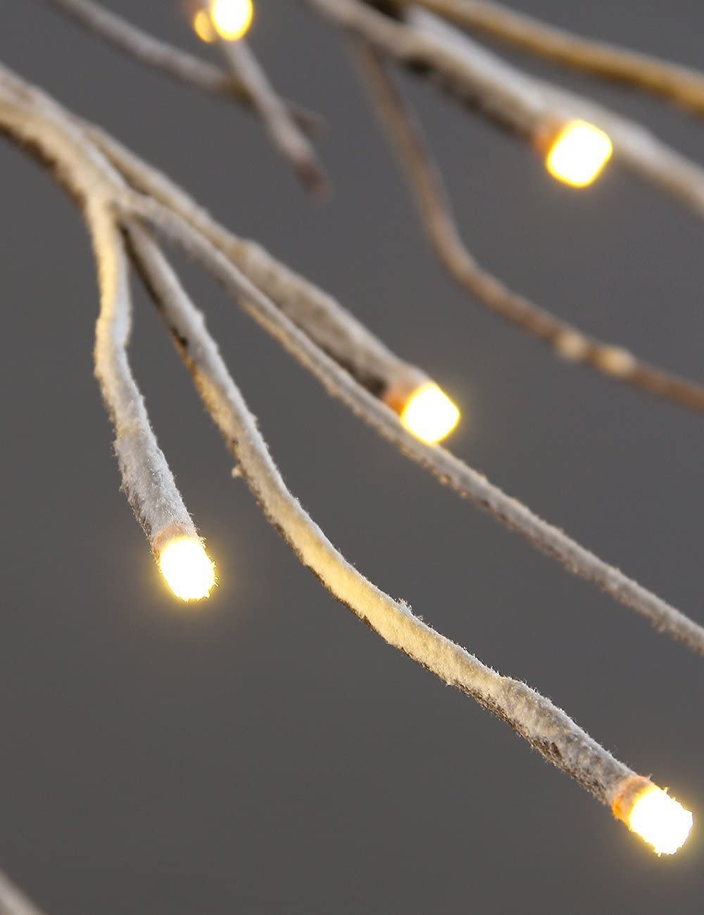 LIGHTSHARE branch supporting an ornament demonstrating bendable shaping advantage