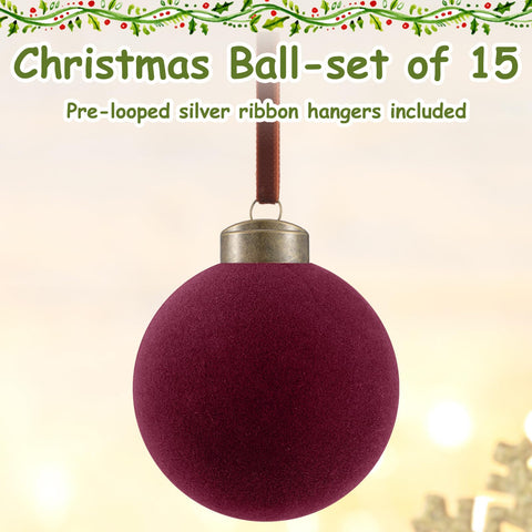 Liliful ornaments hanging on a decorated tree adding warm burgundy contrast and depth