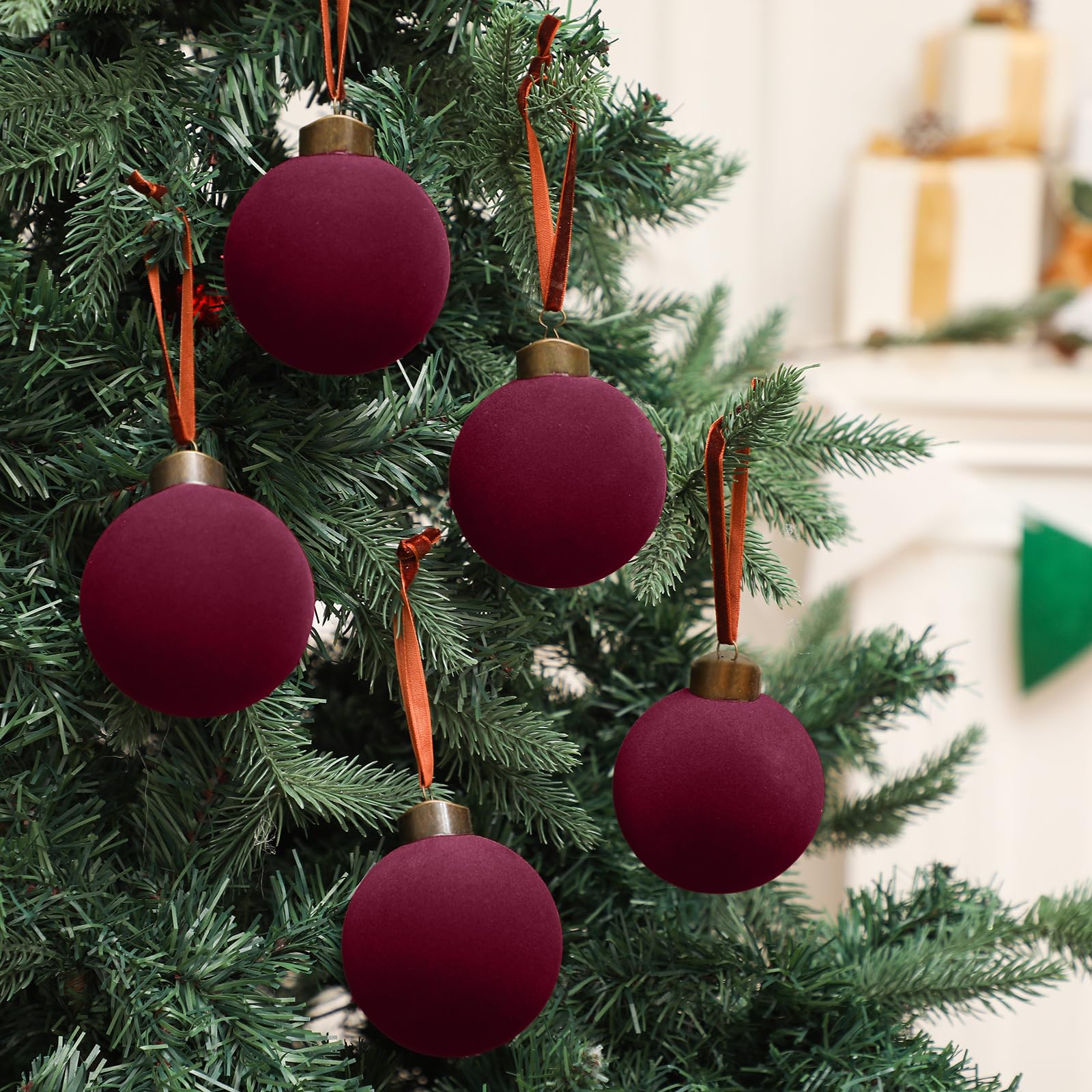Liliful ornament in hand showing scale and lightweight, shatter-resistant benefit