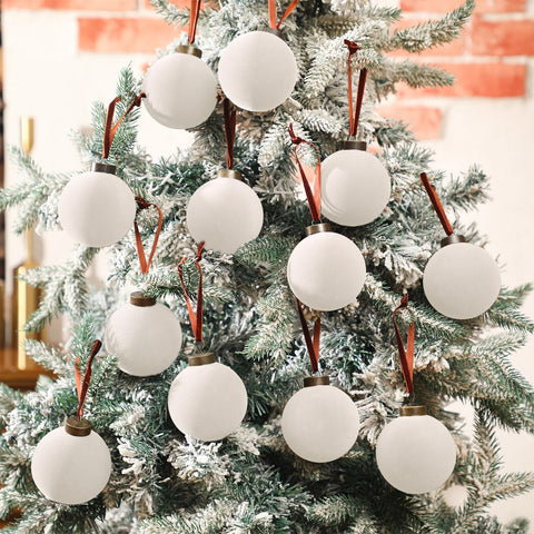 Liliful creamy-white balls styled on mantel and garland extending festive decor