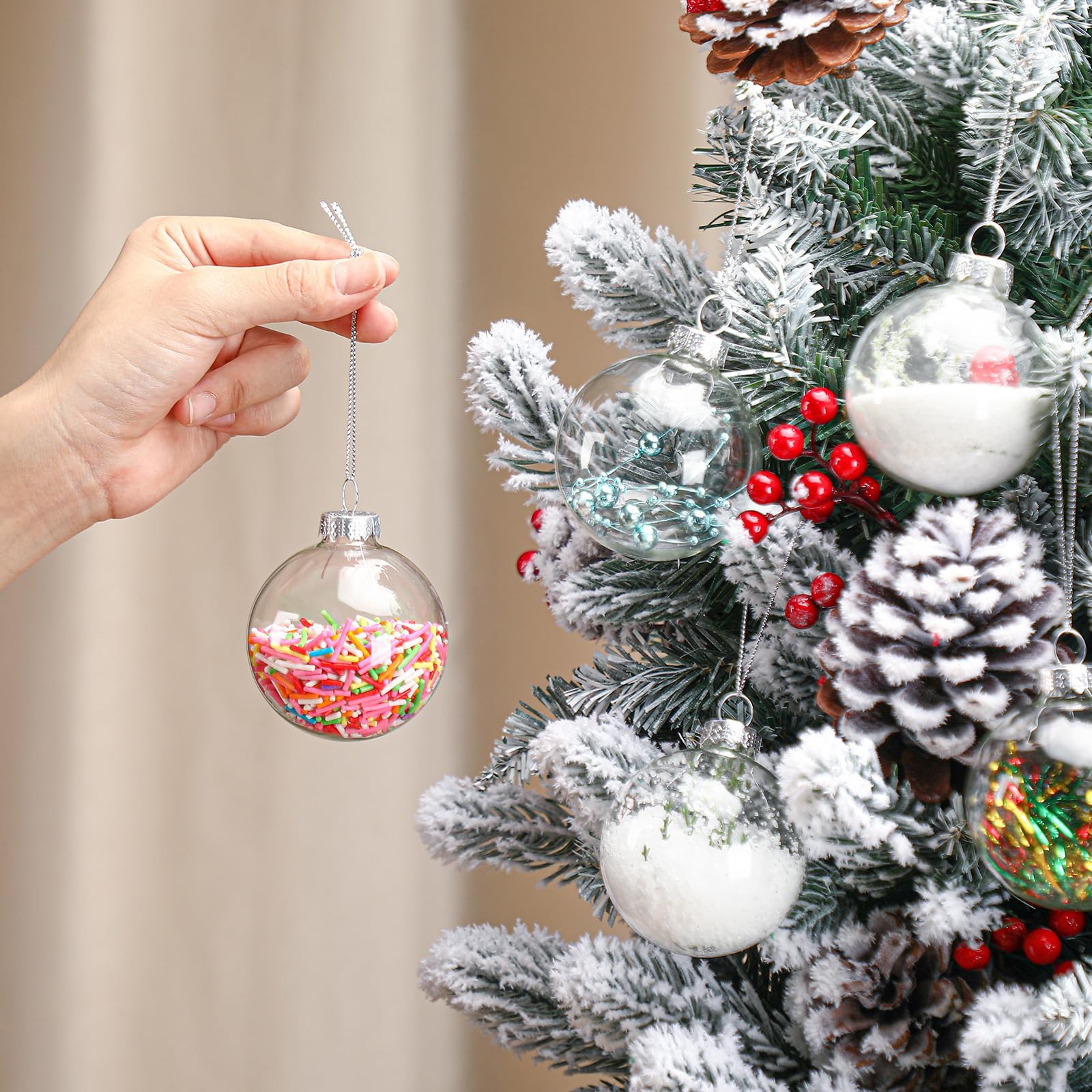 Liliful ornaments hung on a decorated Christmas tree adding elegant seasonal sparkle