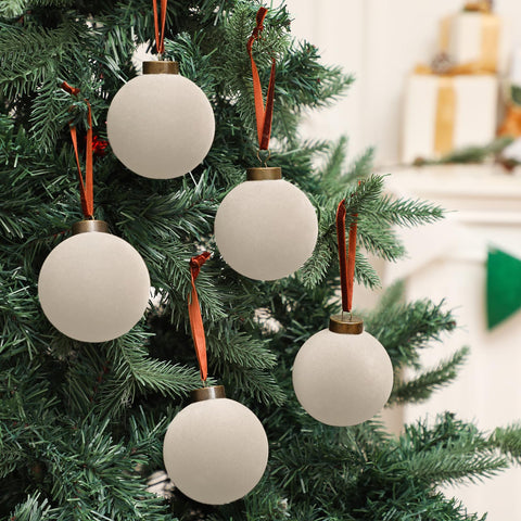 Liliful ornaments on a decorated tree creating an elegant vintage winter effect