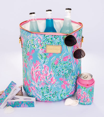 Lilly Pulitzer lifestyle beach scene with pouch set for convenient grab-and-go benefit