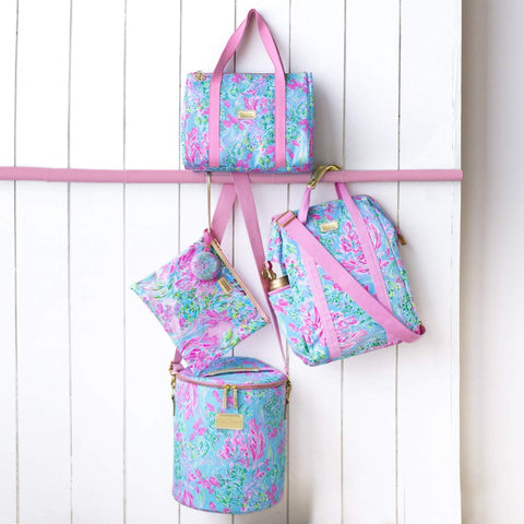 Lilly Pulitzer small zip pouch beside phone showing size and valuables protection