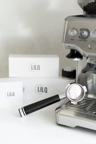 LILQ portafilter next to stock Breville handle showing size and build upgrade