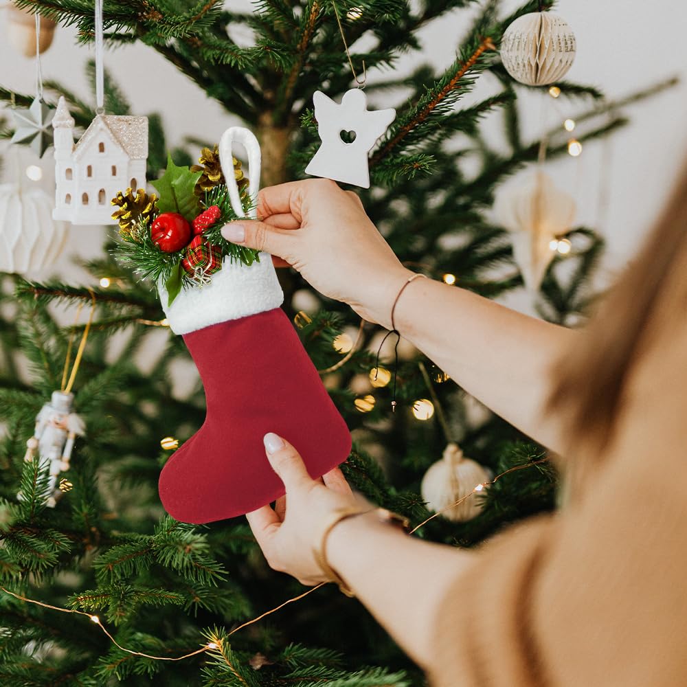 LinaGarten row of mini stockings on mantel with holders showing coordinated decor appeal