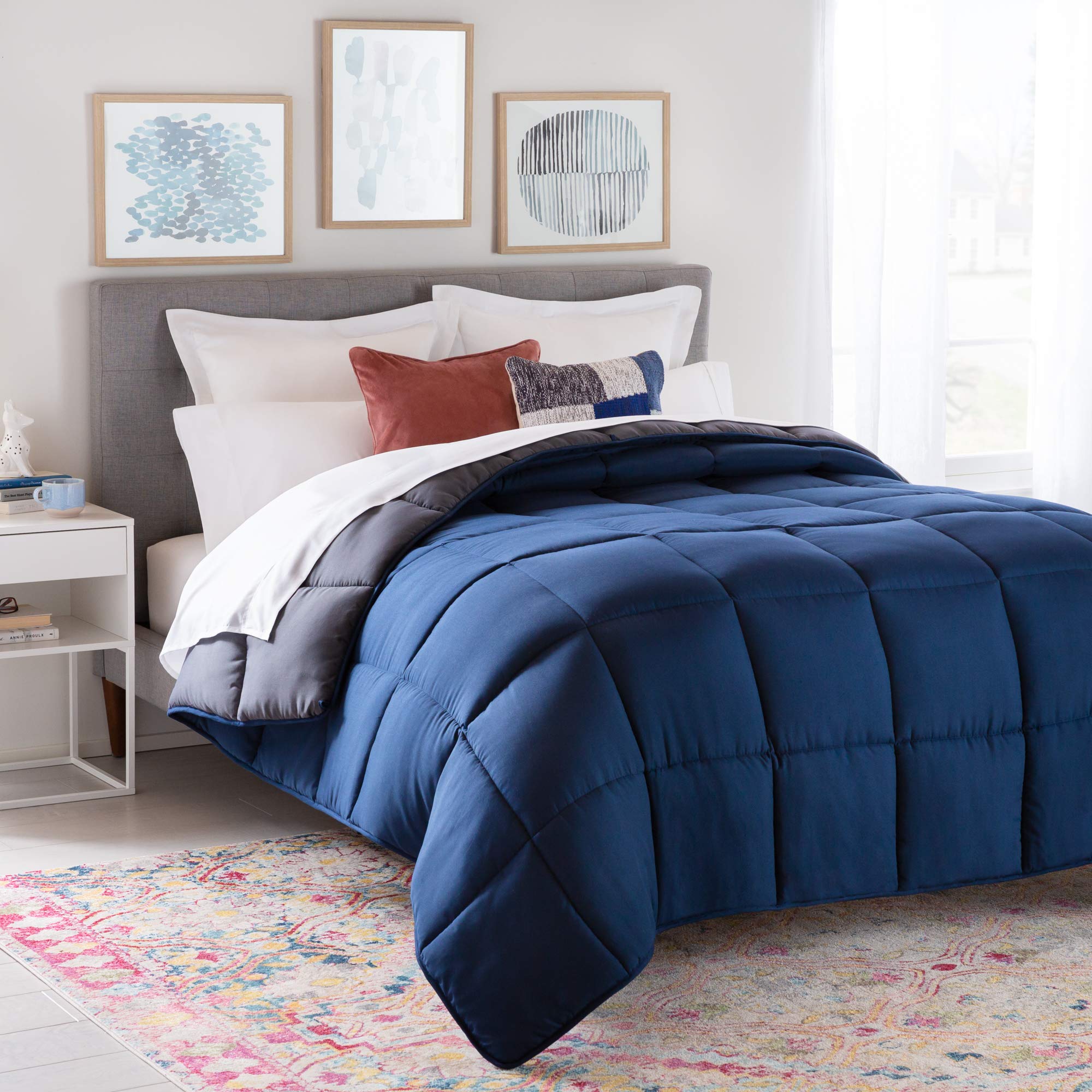Linenspa front flat on Twin XL bed showing navy and graphite reversible colors and neat finish