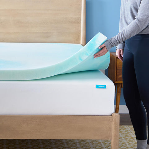 Linenspa topper next to tape measure showing queen size scale