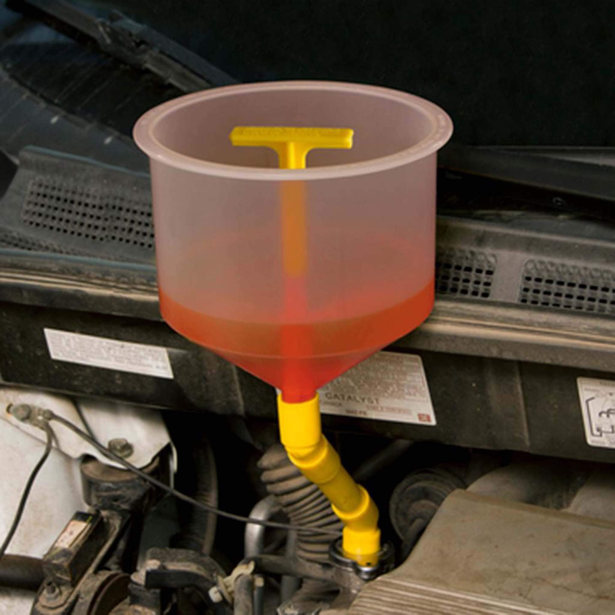 Lisle funnel installed in engine bay reaching radiator cap for easy access benefit