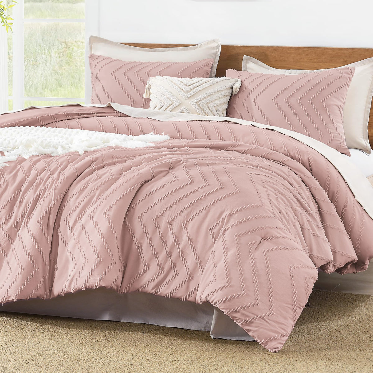 Litanika comforter front view showing tufted blush pink and neat edges for elegant bedding