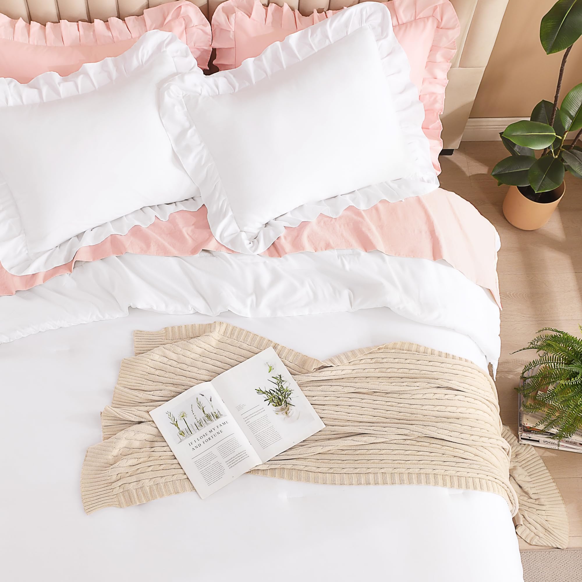 Litanika comforter styled on a full bed in a cozy bedroom setting