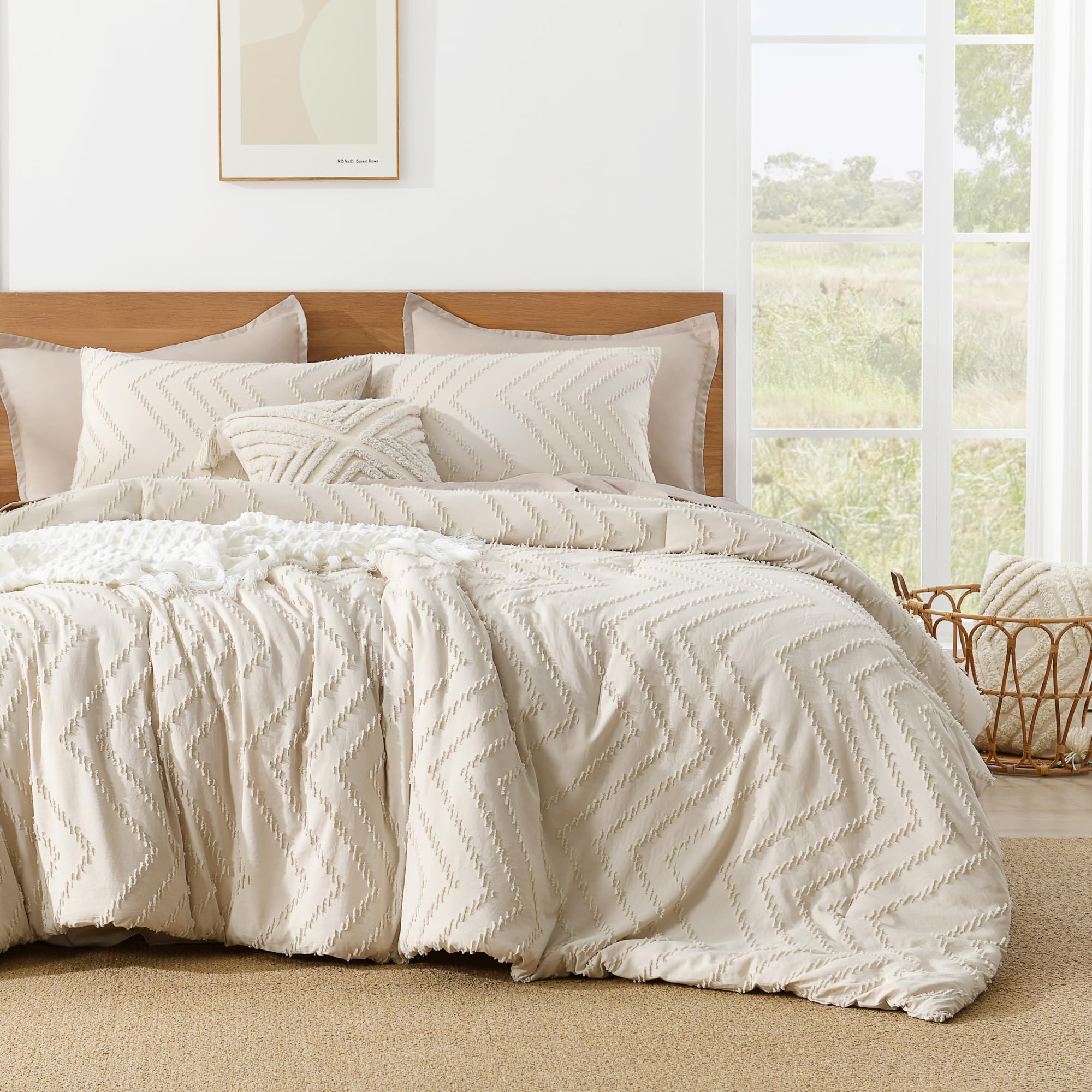 Litanika styled in bedroom with layered pillows highlighting neutral boho aesthetic