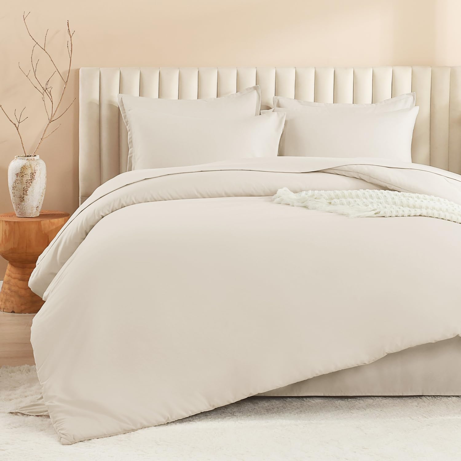 Litanika pillows and shams arrangement highlighting matching pieces for a polished headboard