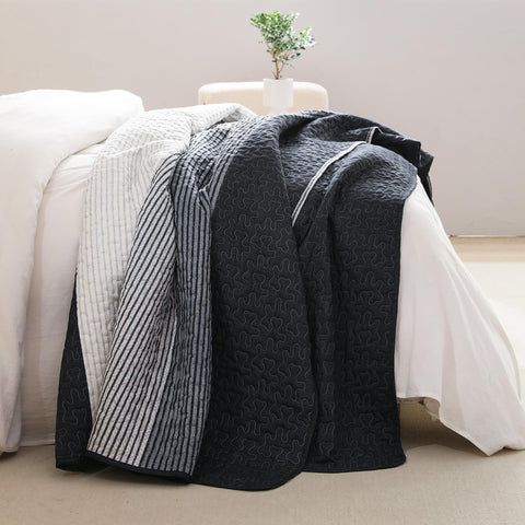 Litanika quilt folded size comparison demonstrating ample coverage and scale