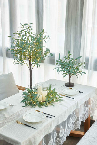 LITBLOOM garland draped on a fireplace mantle creating cozy ambiance